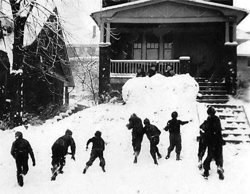 A snowball battle in front of a Beaufort Avenue home in 1940.