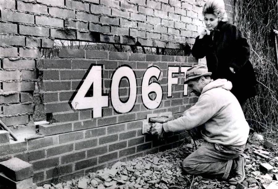 Removing the hallowed section of the
Forbes Field outfield wall in 1970.