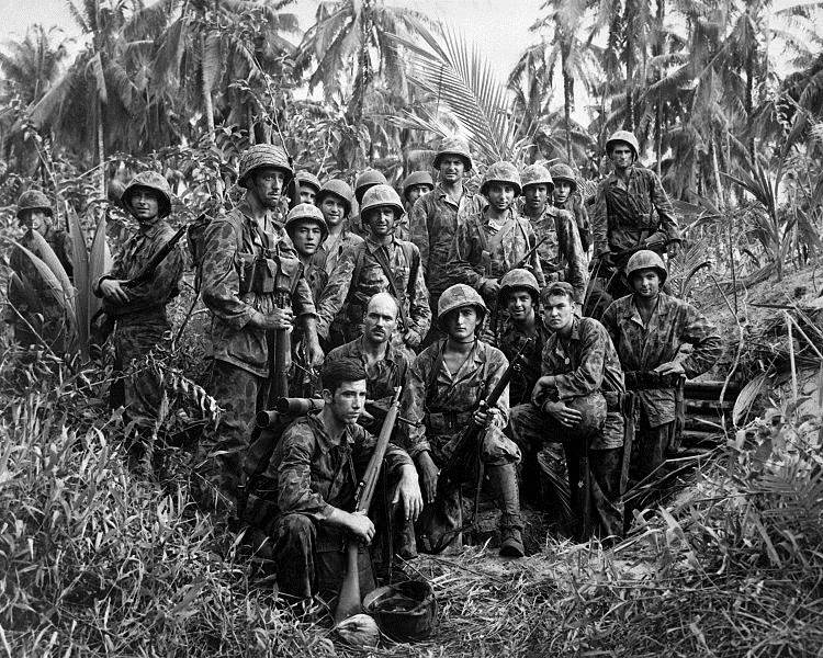 Third Battalion Marine Raiders near
a captured Japanese dugout on Cape Torokina.