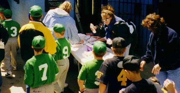 Jane Muller and friends handle the refreshments,
 passing out over 500 hot dogs, chips and little hugs!